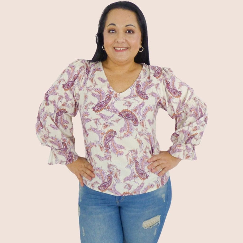 Long sleeve blouse with ruffle detail and bishop sleeves . Bohemian Style inspired made of lightweight fabrics with a fun and vibrant print
