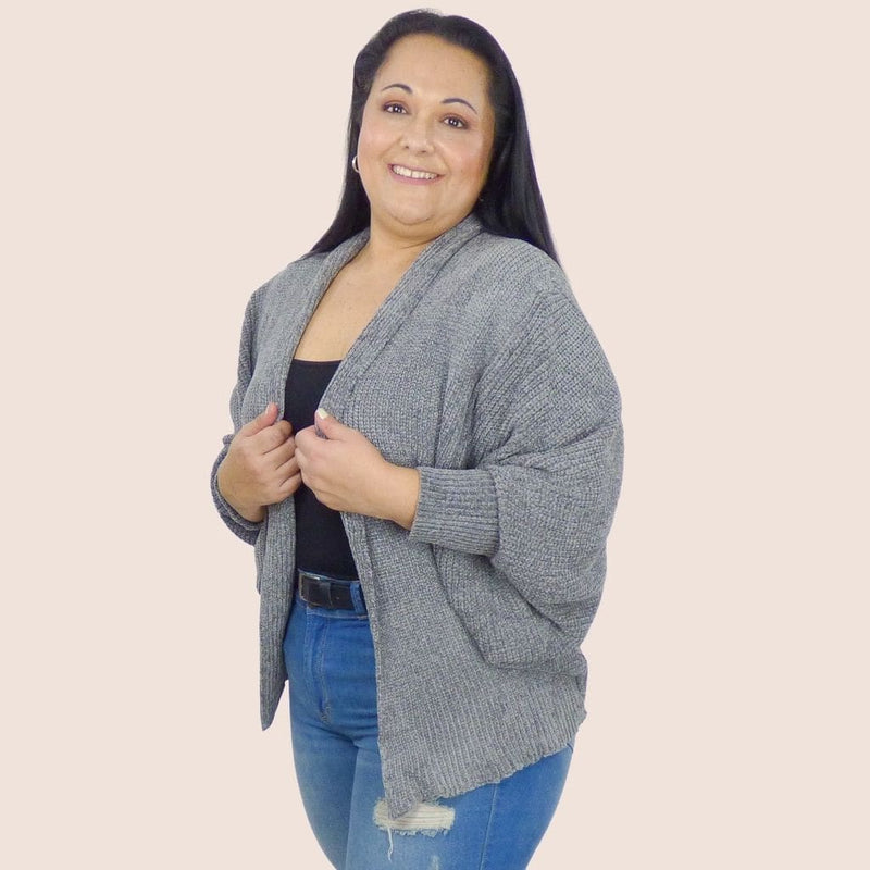 This plus-size cardigan is soft, warm, and ultra-comfortable. The wider-cut dolman sleeves provide great coverage and the longer length provides added warmth.