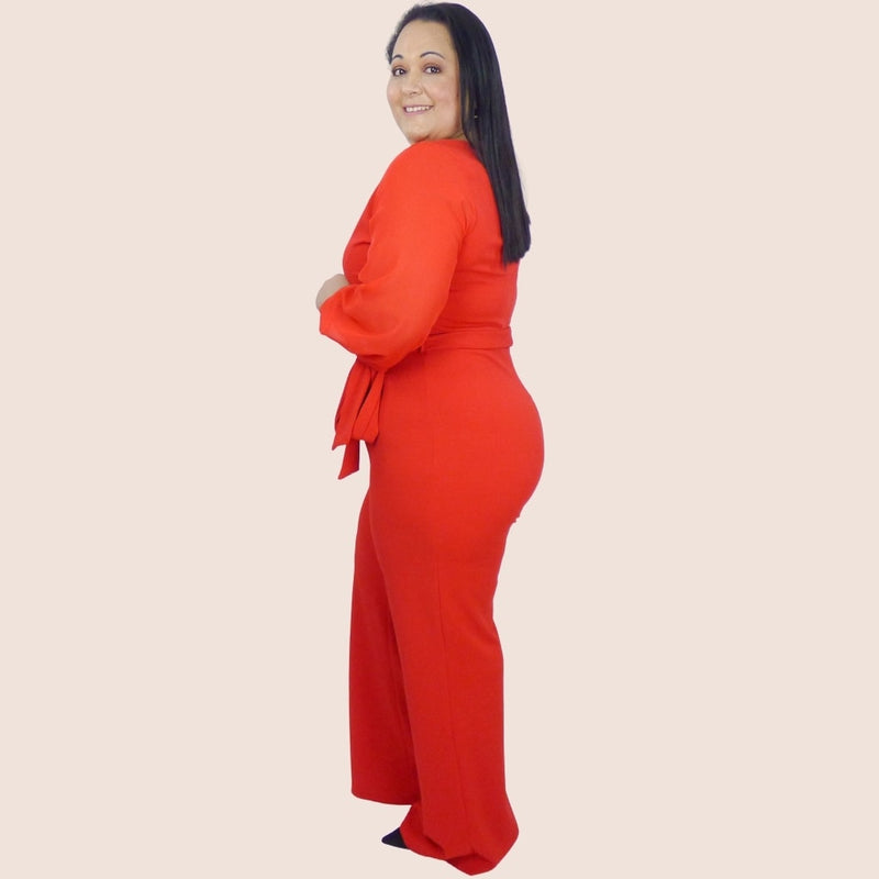 This Straight Leg Pants Jumpsuit has a surplice V neck, chiffon contrast, and knit banded sleeve. It also features a self-tie waist to show off those curves