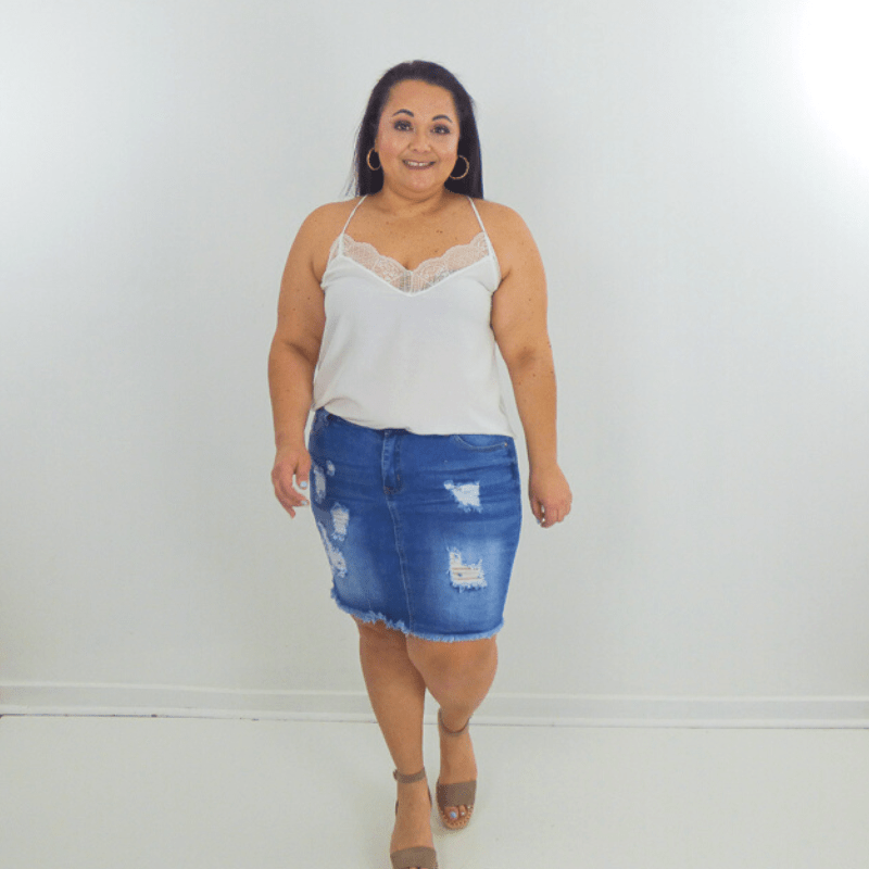 This distressed denim mini skirt is a must-have summer staple. Its a medium was and the mid rise and high stretch keep it comfortable all day long.