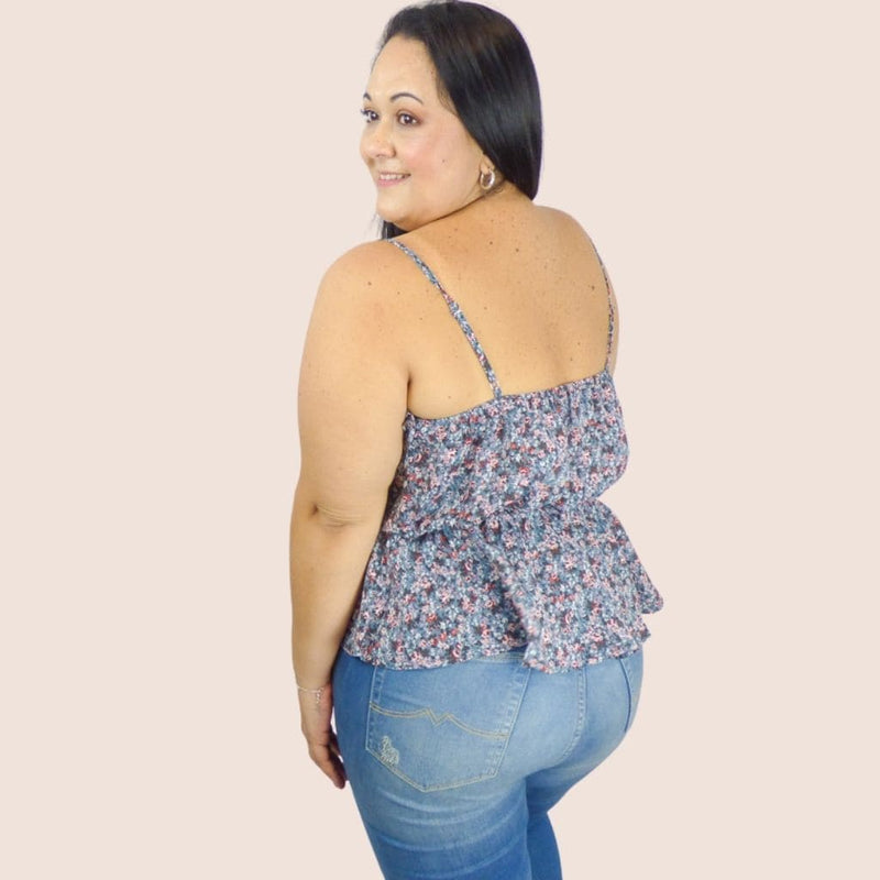 Our Ruffle Floral Plus Top with adjustable spaghetti straps give it an effortlessly look while the elastic waistline adds comfort. A great layering top.