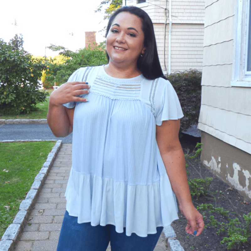 This ruffle short sleeve babydoll top is a must have wardrobe essential. The soft, high stretch fabric makes for a super comfortable fit, and looks amazing with denim shorts or a pant.