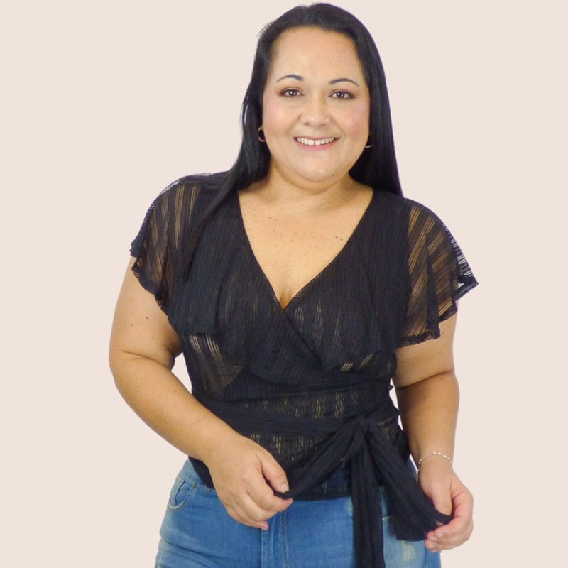 This plus size sheer lace top is ideal for the woman who wants to show off her curves. This is a great top for a date night or a night out on the town with the girls.