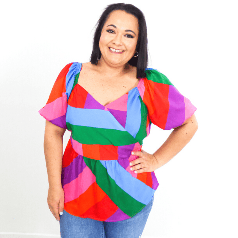You never have to travel far to find color with this bright and pretty top! Style it with skinny jeans and strappy sandals for a fun day out with friends.