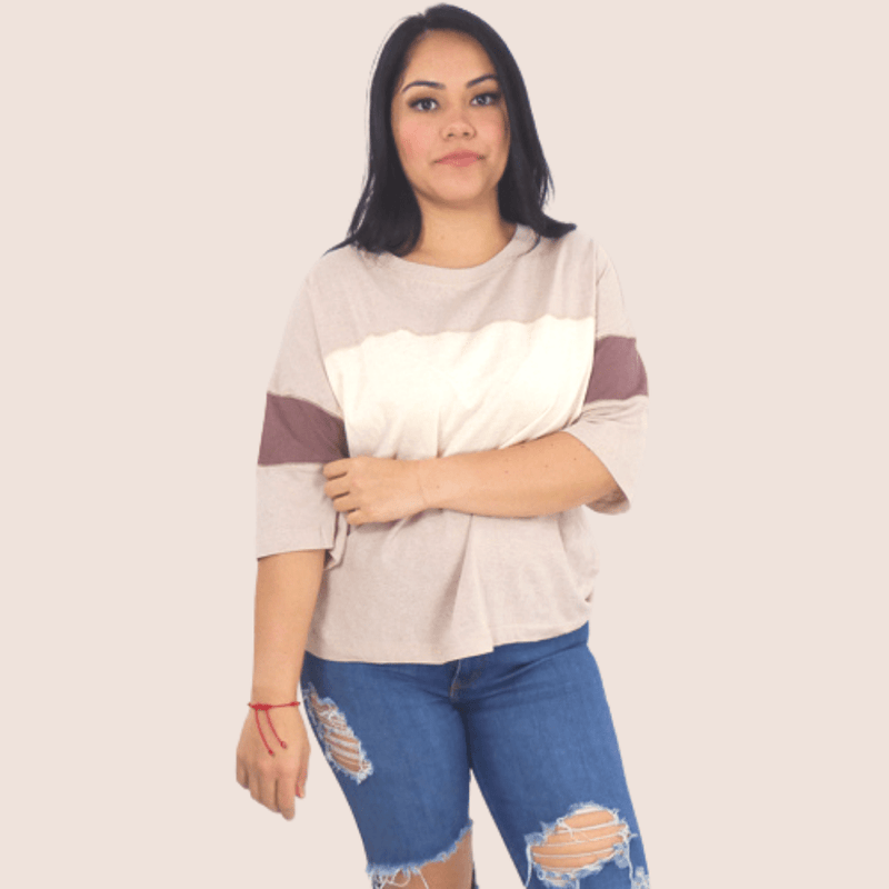 This Half Sleeve Color Block Top is made with light, breathable material perfect for warmer days. The relaxed fit and round neckline make it stylish without being too revealing.