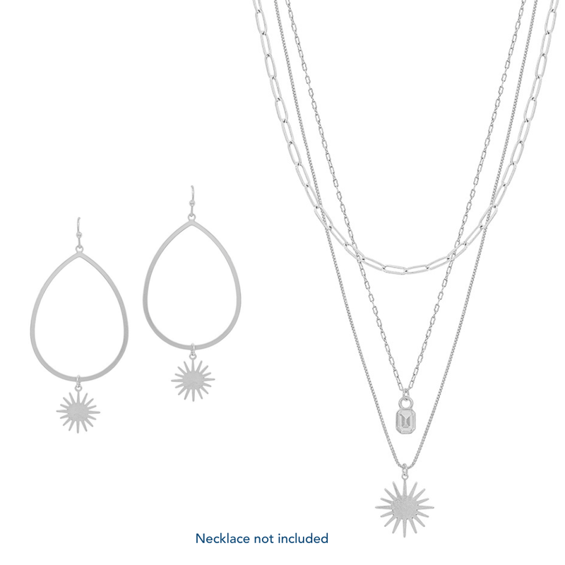 Bring out your inner glam with this Silver Teardrop with Starburst 2" Earring. This piece will impress in any setting. Available in Gold & Silver. Machin Necklace Available