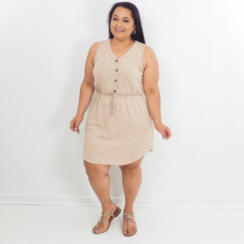 Head out with your besties wearing this dress to the beach or a casual coffee. This sleeveless dress features pockets, ribbed knit fabric and a v-neck button down
