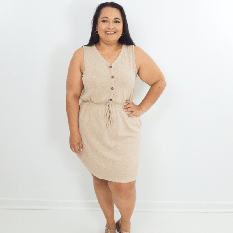 Head out with your besties wearing this dress to the beach or a casual coffee. This sleeveless dress features pockets, ribbed knit fabric and a v-neck button down