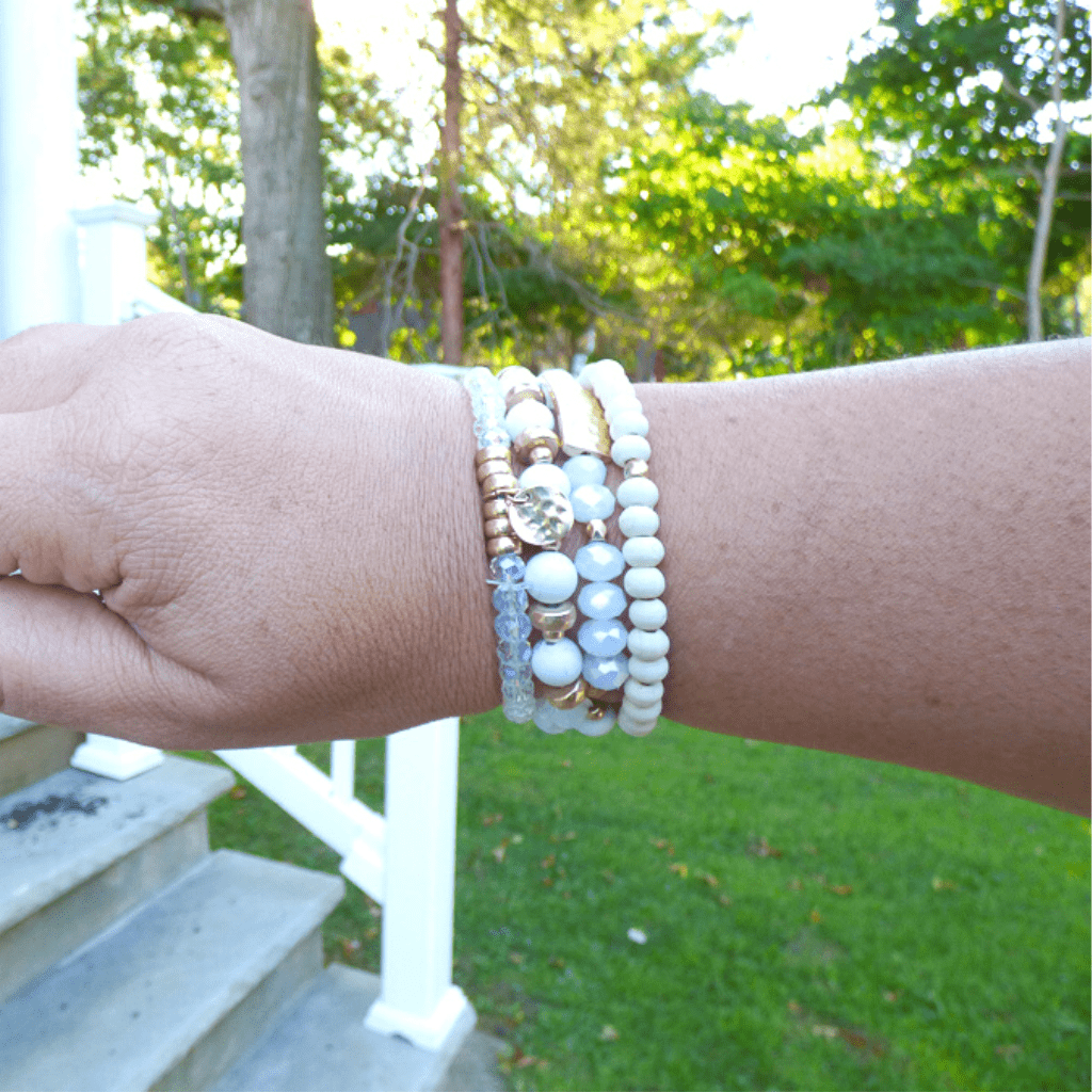 This bracelet set features a natural stone, wood, and crystal stretch bracelet set that is perfect for everyday wear. This bracelet can be worn on its own, or stacked with other bracelets.