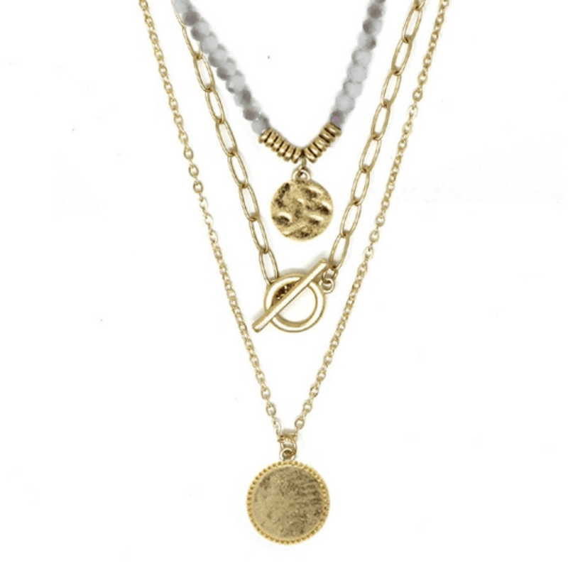This triple-layered necklace is crafted using natural stones and gold accents. The white color and simplicity of the design make this a classic piece that can be worn with any outfit or on any occasion.