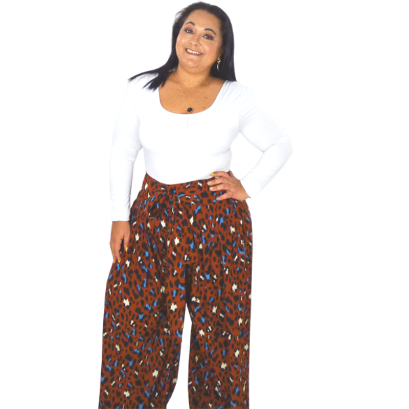 A wide leg pant that's roomy through the legs, giving you a laid-back silhouette. The high rise waist is comfortable while the elastic waist and front tie cinches everything in and adds definition.